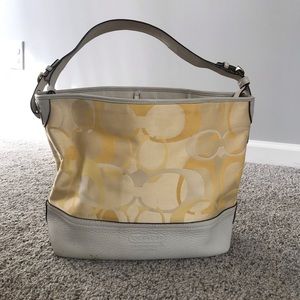 yellow Coach bag with white leather